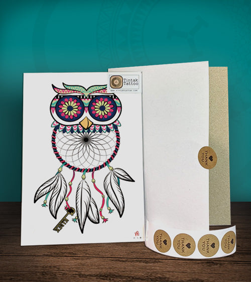 Tintak temporary tattoo sticker with owl dream catcher design, with its hard board packaging.
