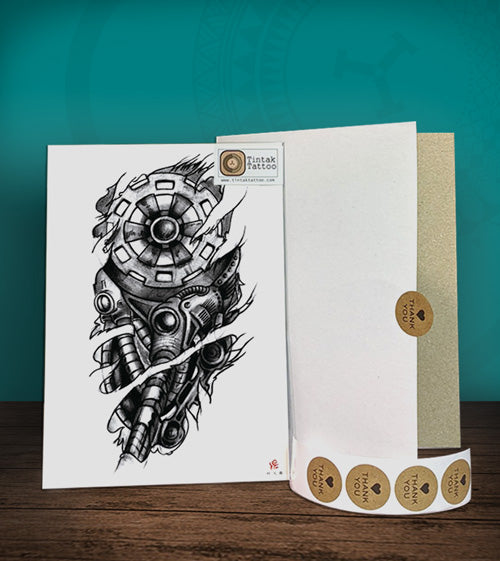 Temporary tattoo sticker with Biomech design with its hard board packaging.
