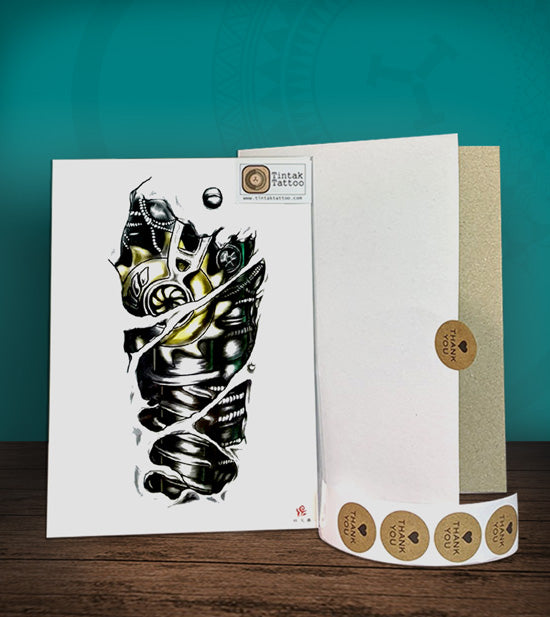 Tintak temporary tattoo sticker with biomech design, with its hard board packaging.