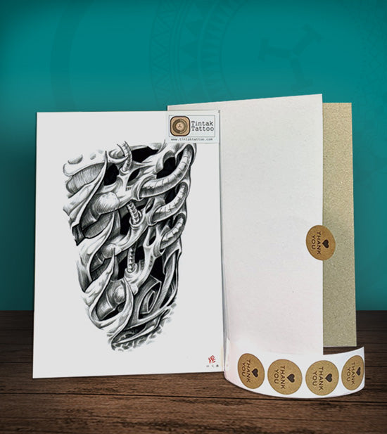 Tintak temporary tattoo sticker with biomech design, with its hard board packaging.