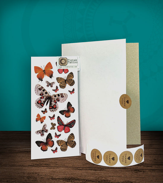 Tintak temporary tattoo sticker with butterfly designs, with its hard board packaging.