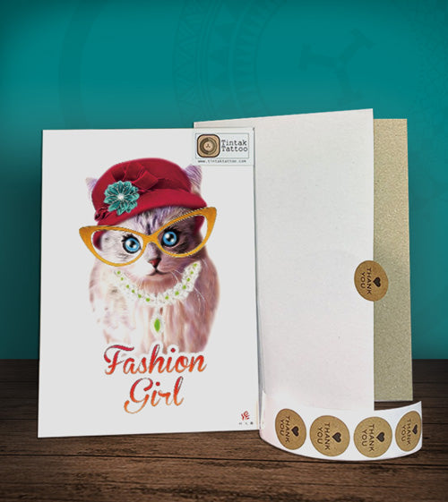 Tintak temporary tattoo with cat design, with its hard board packaging.