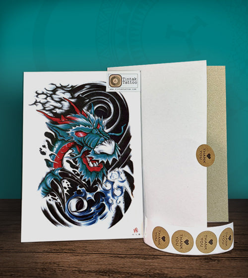 Tintak temporary tattoo sticker with dragon design, with its hard board packaging.