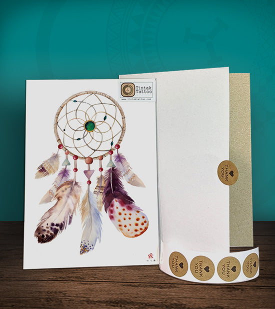 Tintak temporary tattoo sticker with dream catcher design, with its hard board packaging.