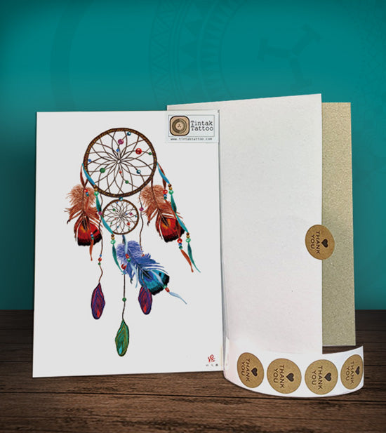 Tintak temporary tattoo sticker with dream catcher design, with its hard board packaging.