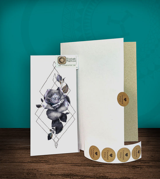 Tintak temporary tattoo sticker with flower design, with its hard board packaging.