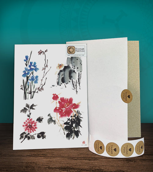 Tintak temporary tattoo sticker with flower designs, with its hard board packaging.