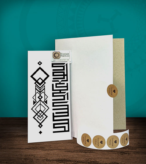 Tintak temporary tattoo sticker with geometric design, with its hard board packaging.