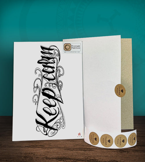 Tintak temporary tattoo sticker with "Keep Calm" written written design, with its hard board packaging.