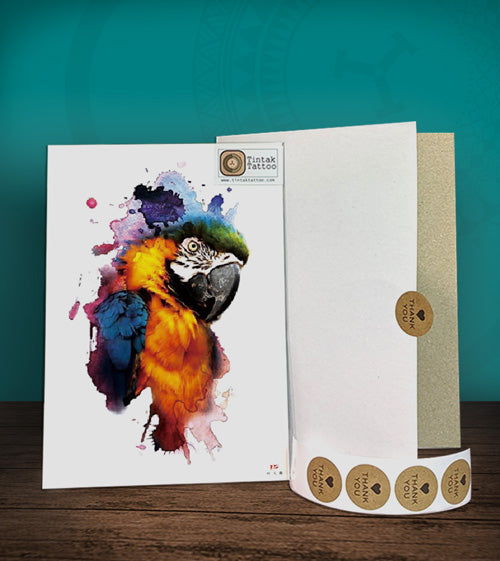 Tintak temporary tattoo sticker with watercolored parrot design, with its hard board packaging.