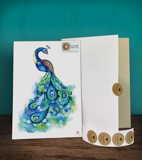 Tintak temporary tattoo sticker with colored peacock design, with its hard board packaging.