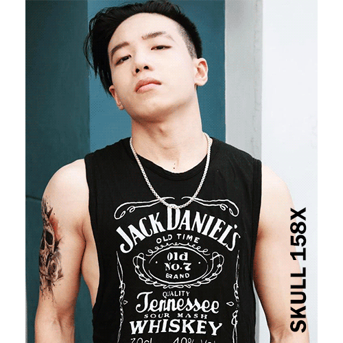 A man wearing Jack Daniels Shirt with a roses and skull temporary tattoo on his arm.