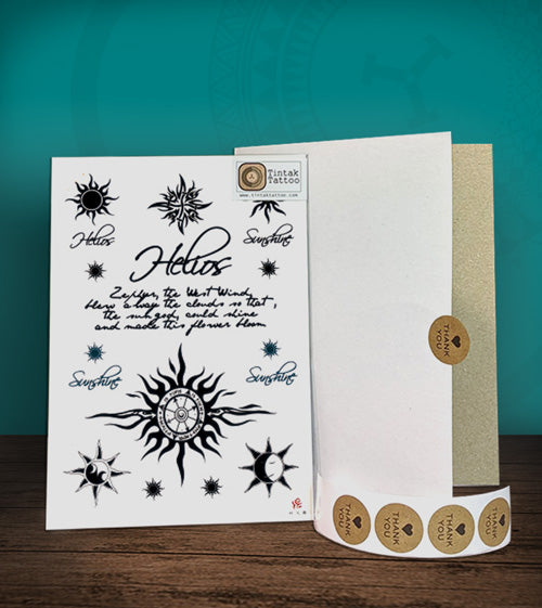 Tintak temporary tattoo sticker with written words, moon, and sun designs, with its hard board packaging.