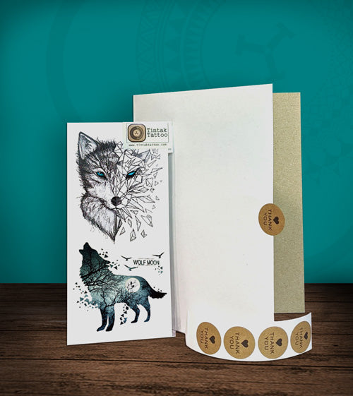 Tintak temporary tattoo sticker with moon wolf design, with its hard board packaging.