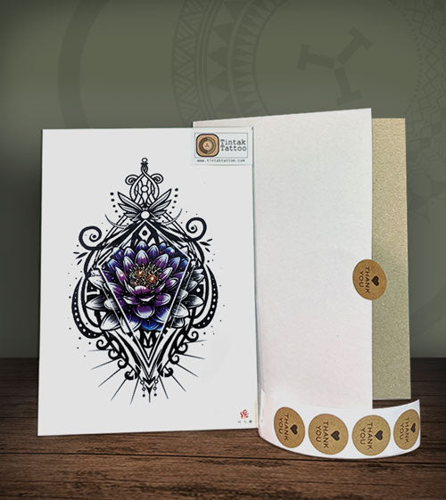 Tattoo design on a card with a packaging box featuring a brand logo.