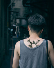 Load image into Gallery viewer, A picture of a man with a 3-star and a sun temporary tattoo on his back.