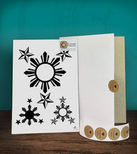 Load image into Gallery viewer, Tintak temporary tattoo sticker with 3 stars and a sun design, with its hard board packaging.