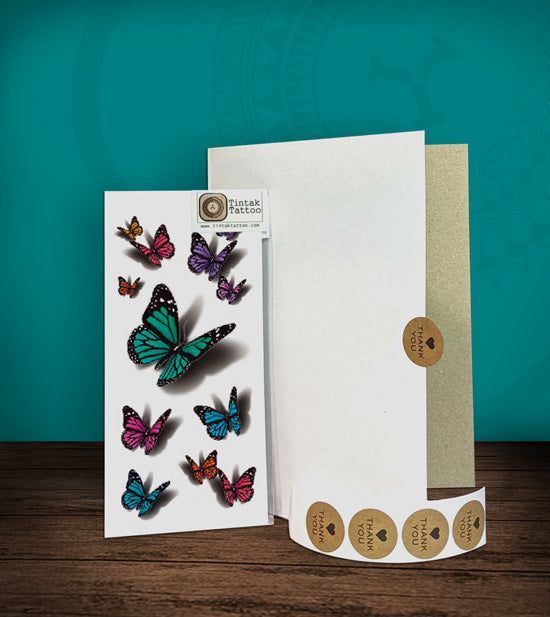 Tintak temporary tattoo sticker with 3D butterfly designs, with its hard board packaging.