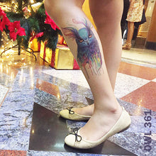 Load image into Gallery viewer, Woman&#39;s lower leg with temporary tattoo sticker in watercolored owl design.