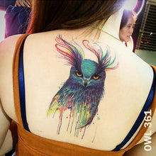 Load image into Gallery viewer, Woman&#39;s back with colored owl temporary tattoo design.