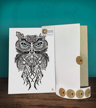 Load image into Gallery viewer, Tintak temporary tattoo sticker with tribal owl design, with its hard board packaging.