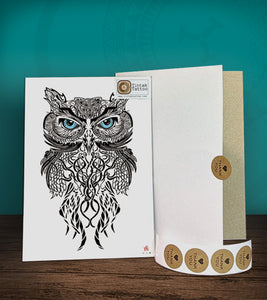 Tintak temporary tattoo sticker with tribal owl design, with its hard board packaging.