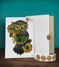 Load image into Gallery viewer, Tintak temporary tattoo sticker with green owl design and roses, with its hard board packaging.