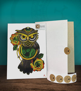 Tintak temporary tattoo sticker with green owl design and roses, with its hard board packaging.