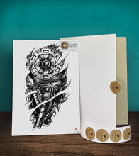Load image into Gallery viewer, Temporary tattoo sticker with Biomech design with its hard board packaging.