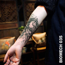 Load image into Gallery viewer, black and gray semi-biomechanical temporary tattoo sticker on woman&#39;s arm