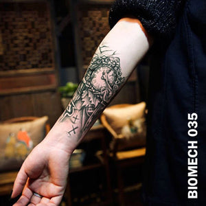 black and gray semi-biomechanical temporary tattoo sticker on woman's arm
