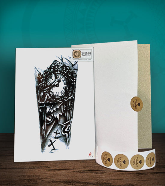 Tintak temporary tattoo sticker with biomech design, with its hard board packaging.