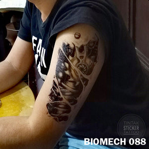 black and gray biomechanical temporary tattoo sticker on man's arm