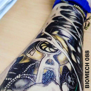 black and gray biomechanical temporary tattoo sticker on man's arm