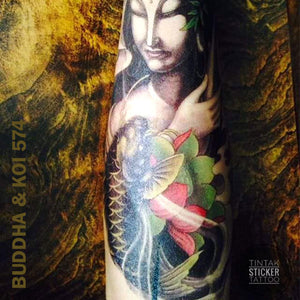 Buddha and Koi Fish temporary tattoo sticker applied in an arm.