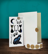 Load image into Gallery viewer, Tintak temporary tattoo with cat designs, with its hard board packaging.