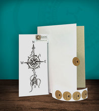 Load image into Gallery viewer, Tintak temporary tattoo sticker with compass design, with its hard board packaging.
