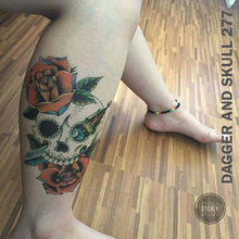 Load image into Gallery viewer, Dagger and skull temporary tattoo on woman&#39;s leg.