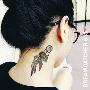 A woman with a small dream catcher temporary tattoo sticker on the right side of her neck.