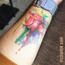 Load image into Gallery viewer, temporary tattoo sticker on a woman&#39;s arm with watercolored rose flower design.