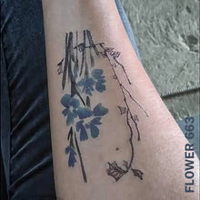 Load image into Gallery viewer, Woman&#39;s arm with flower temporary tattoo sticker.