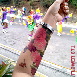 Peony flower temporary tattoo sticker on woman's arm on captured while on the street.