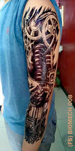 Load image into Gallery viewer, Full sleeve temporary tattoo on a man&#39;s arm with biomech design.