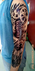 Full sleeve temporary tattoo on a man's arm with biomech design.