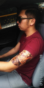 A man inside the car with a timeless half sleeve temporary tattoo.