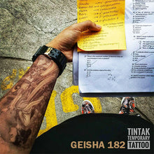 Load image into Gallery viewer, Man&#39;s arm with his notes and his geisha temporary tattoo.