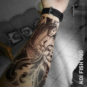 koi fish temporary tattoo sticker on mans arm