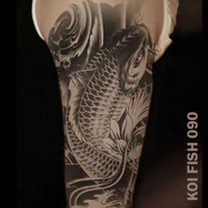 Koi Fish temporary tattoo sticker on man's arm.