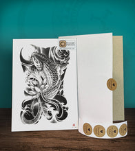 Load image into Gallery viewer, Tintak temporary tattoo sticker with black and gray koi fish design, with its hard board packaging.