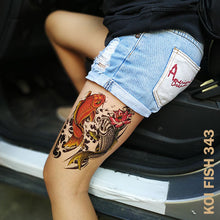 Load image into Gallery viewer, Woman&#39;s leg with two colored koi fish temporary tattoo sticker design and about to enter a car.